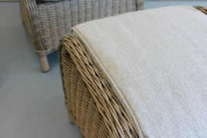 Close up of outdoor furniture wicker footstool and cushion from Mountain Weave